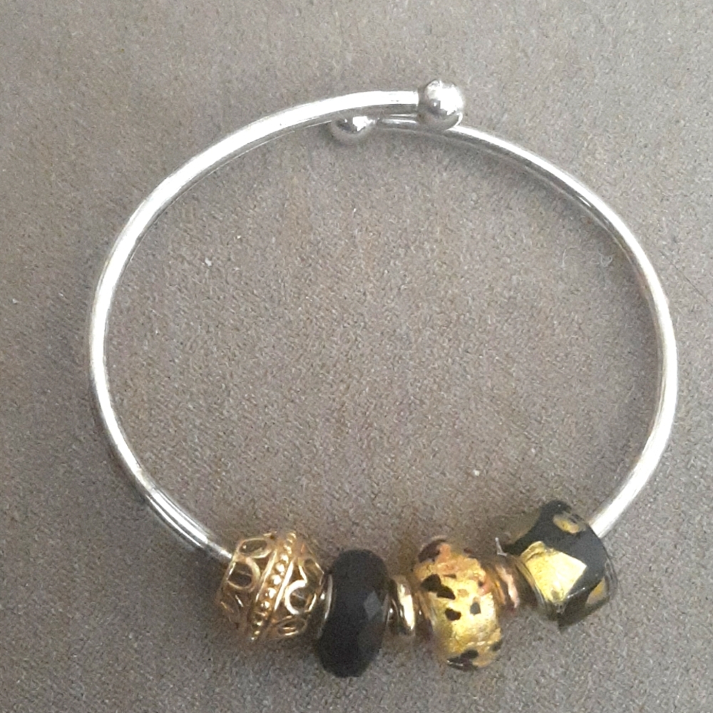 Sterling silver charm bracelet with 4 charms
